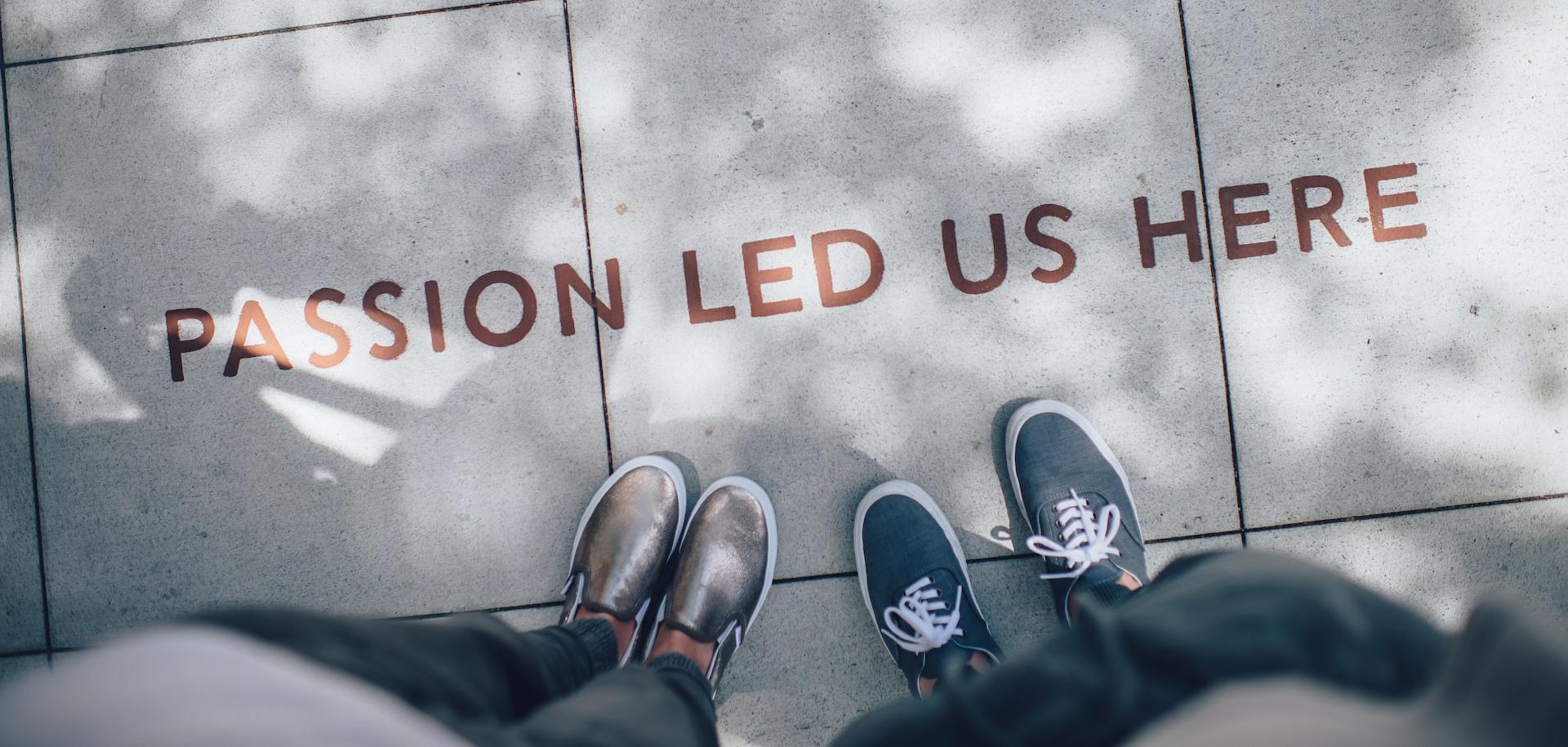 two person standing on gray tile paving